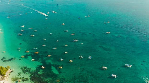 White sandy beach with tourists and hotels in Boracay Island, Philippines. aerial view. Seascape with beach on tropical island. Summer and travel vacation concept.