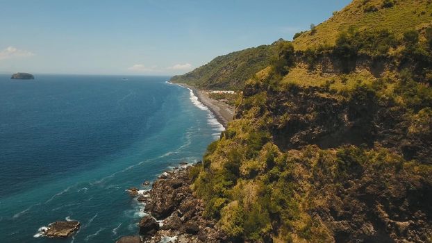 Aerial view sea coast, ocean, mountains, sea, beach, sky, clouds. Bali, Indonesia Seascape with Seashore on the background of mountains