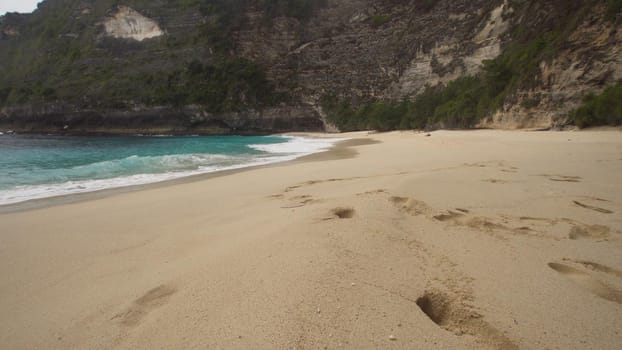 Tropical beach with turquoise water among the rocks, Karang Dawa, Nusa Penida Island, Bali, Indonesia. Travel concept.