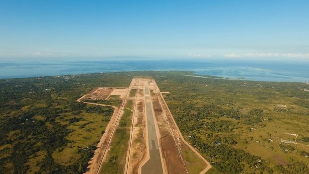 Construction of a new airport terminal on Panglao. Aerial view Modern airport terminal construction site. Construction of a landing strip on the island of Bohol, Philippines. Landing strip. Travel concept.
