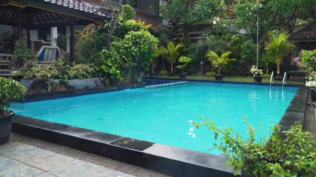 Luxurious open air swimming pool at resort. Swimming pool with turquoise water in a luxury hotel. Travel concept.