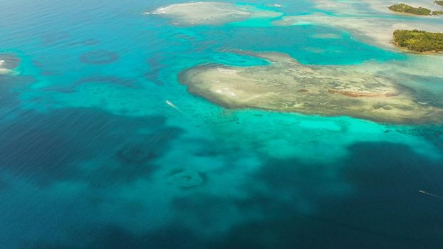 Turquoise lagoon surface on atoll and coral reef, copy space for text. Top view transparent turquoise ocean water surface. background texture