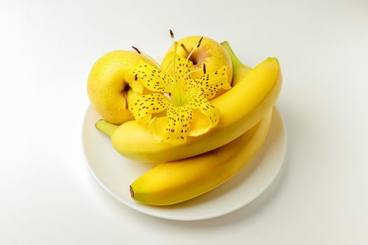 tiger Lily with banana and Apple on a white background close-up. isolate. High quality photo