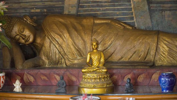 Bali, Indonesia - October 15, 2017: Statue of the Buddha god in the Buddhist temple Brahma Vihara Arama with statues of the gods on Bali island, Indonesia. Bali Architecture, Ancient design. Travel concept.