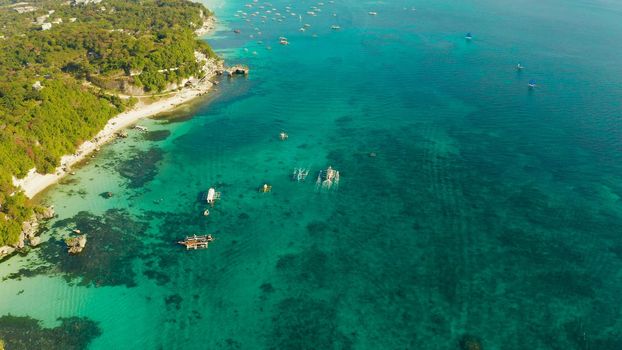 White sandy beach with tourists and hotels in Boracay Island, Philippines. aerial view. Seascape with beach on tropical island. Summer and travel vacation concept.