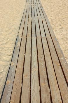 wooden path on the beach dune sand. High quality photo