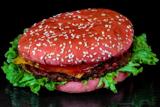 red hamburger on a black background macro. High quality photo