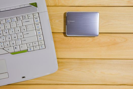 laptop on a wooden background top view. High quality photo