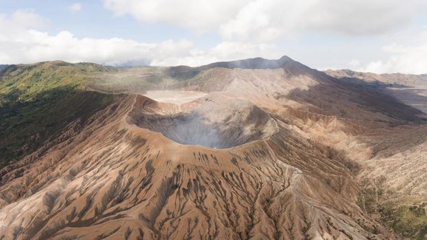 Crater with active volcano smoke in East Jawa, Indonesia. Aerial view of volcano crater Mount Gunung Bromo is an active volcano,Tengger Semeru National Park.