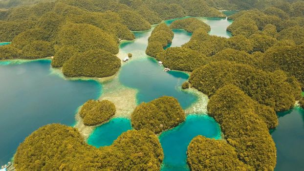 aerial seascapel Islands with bay and lagoon, beach. Tropical landscape hill, clouds and mountains rocks with rainforest. Azure water of lagoon. Shore Landscape Bay. Aerial video.Seascape. Travel concept.