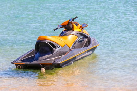 a jet ski stands on the water without people. High quality photo