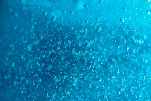 air bubbles in blue shampoos as background. High quality photo