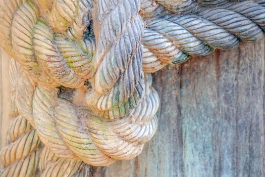 a rope tied to a knot on the pier. High quality photo