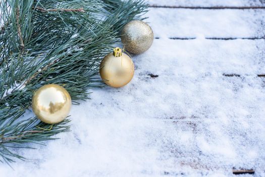 Winter background. Empty wooden plank with snowy border with pine branch and christmas ball decoration, copy space for text Wood table to. For product display Christmas time mock up