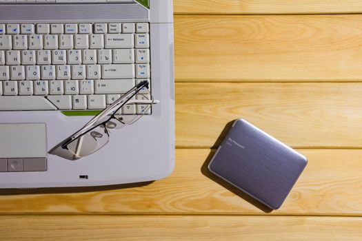 laptop on a wooden background top view. High quality photo