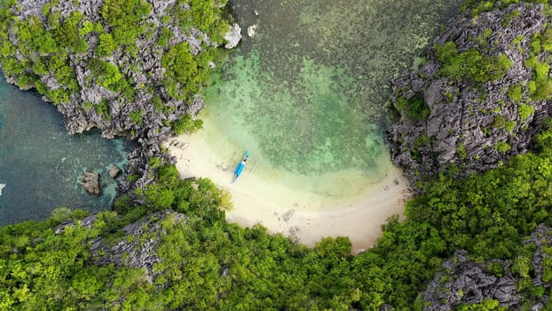 Tropical islands and blue sea, aerial view. Kagbalinad Islands, Philippines. Rocky islands with trees. Summer and travel vacation concept. Rocky island with rainforest