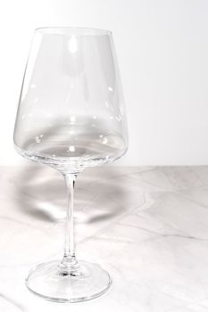 wine glass on marble on white background. High quality photo