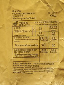 Chinese customs declaration and postage meter on a foreign parcel from china. (Translation: see English text below each Chinese text)