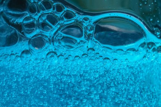 air bubbles in blue shampoos as background. High quality photo