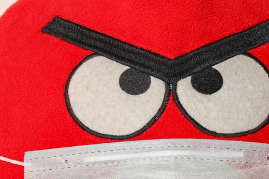 angry bird in a mask close up. High quality photo