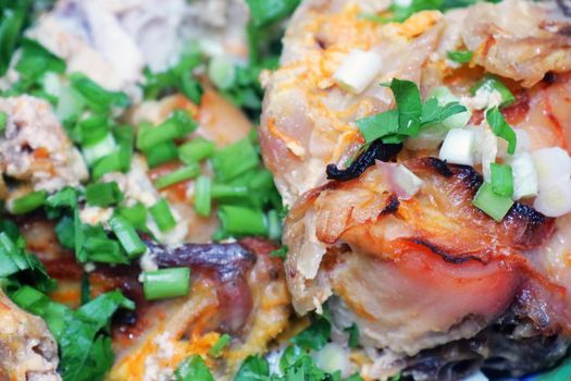 fried pork meat sprinkled with ground green onions on the entire frame macro