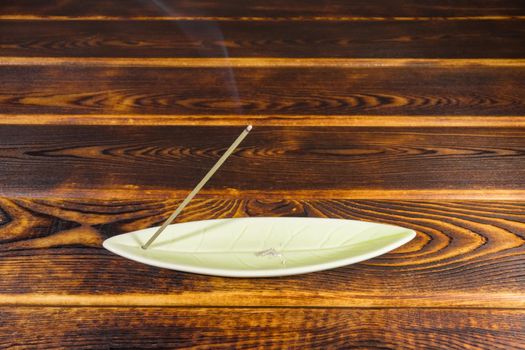 incense sticks on a wooden background isolate. High quality photo