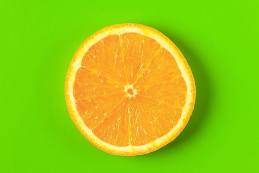 orange slice on a green background macro. place for the label. High quality photo