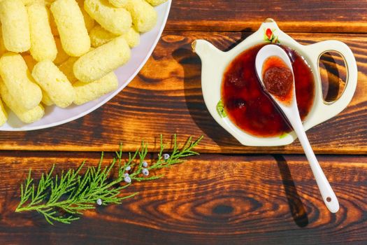 corn sticks on a plate on a wooden background. High quality photo