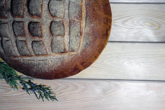 a loaf of bread on a wooden background macro