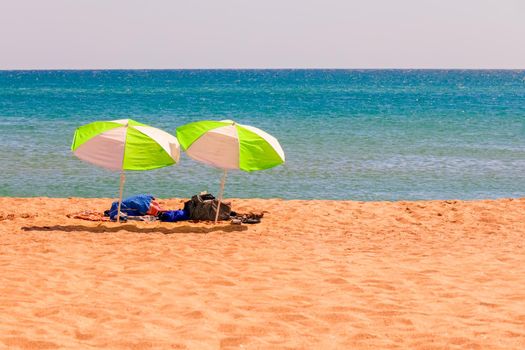 umbrellas from the sun on the beach. sea tour. High quality photo