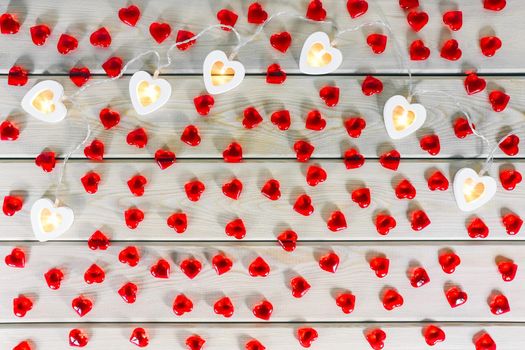 hearts garland on a wooden background top view . High quality photo