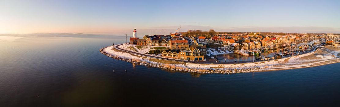 Panoramic view at the lighthouse of Urk Flevoland Netherlands, Urk during winter with white snow covered the beach. Winter in the Netherlands