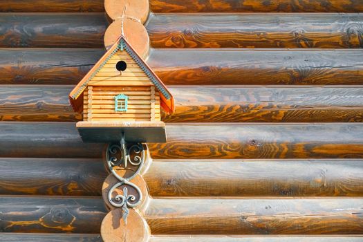 birdhouse on the wall of timber macro. High quality photo