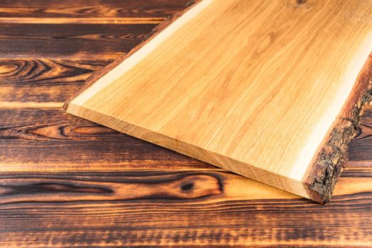 cutting Board on a wooden background top view. High quality photo