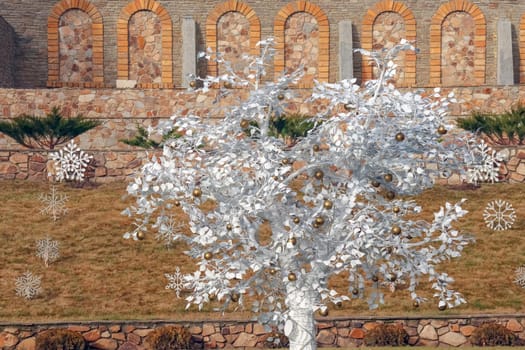 white decorated tree on the background of the castle. High quality photo