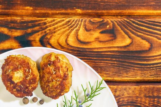 cutlets on a plate on a wooden background. High quality photo