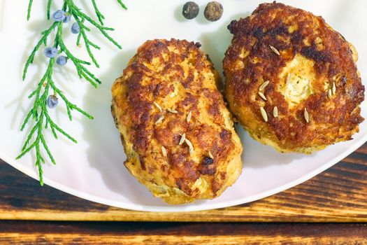 cutlets on a plate on a wooden background. High quality photo