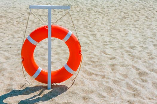 lifebuoy on dune sand. water rescue service. High quality photo