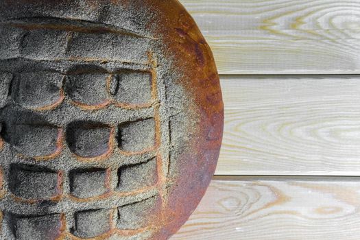 a loaf of bread on a wooden background macro