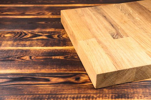 cutting Board on a wooden background top view. High quality photo