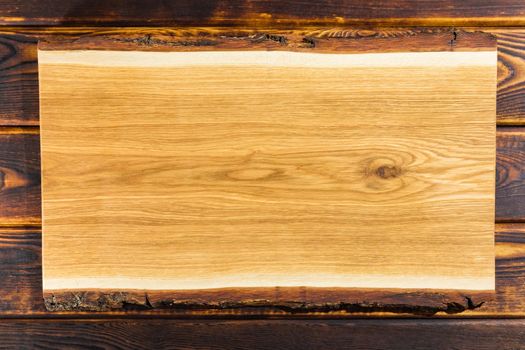 cutting Board on a wooden background top view. High quality photo