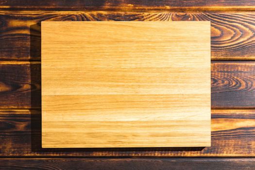 cutting Board on a wooden background top view. High quality photo