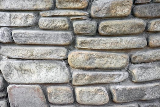 masonry wall paving stones as a background close up. High quality photo