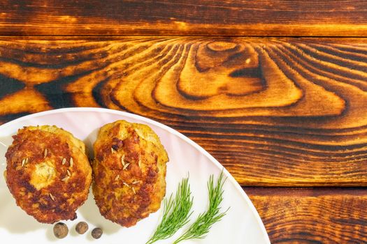 cutlets on a plate on a wooden background. High quality photo