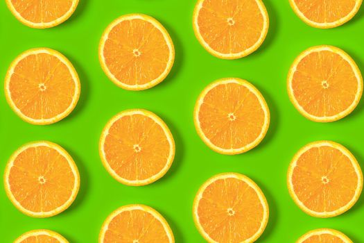 colorful pattern of orange slices on a colorful background top view. High quality photo