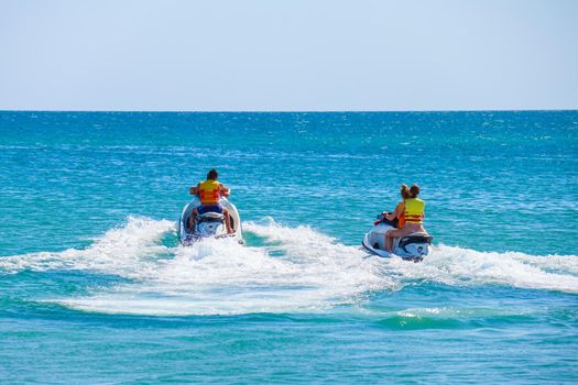 a man rides a jet ski in the open sea. High quality photo