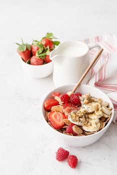 Healthy eating and dieting. Healthy breakfast, cereal, fresh berries and milk in a bowl with copy space