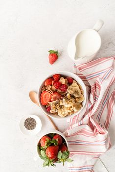Healthy eating and dieting. Healthy breakfast, cereal, fresh berries and milk in a bowl with copy space, top view flat lay