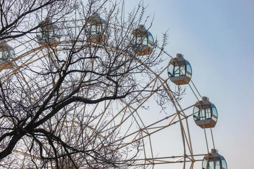 Ferris wheel against the blue sky as background. High quality photo