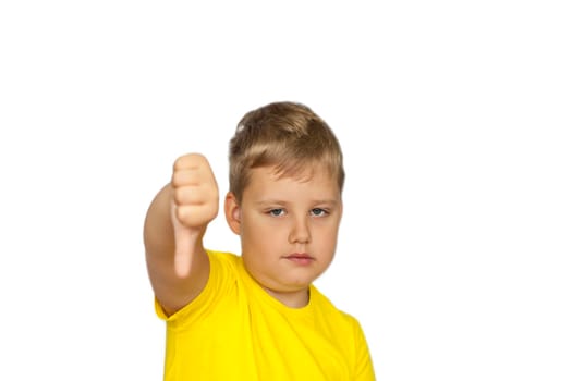 A boy in a yellow T-shirt on a white background points at a negative rating. Dislike. The concept of a banner with information. Space for the text. Concepts